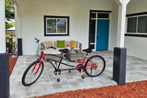 a red bike parked in front of a house at Fishing Paradise Lake Poinsett Home with Deck! in Cocoa