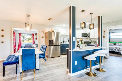 a kitchen and dining room with blue and white appliances at 2 Mi to Beach Canal-Front Home in Hernando Beach in Hernando Beach
