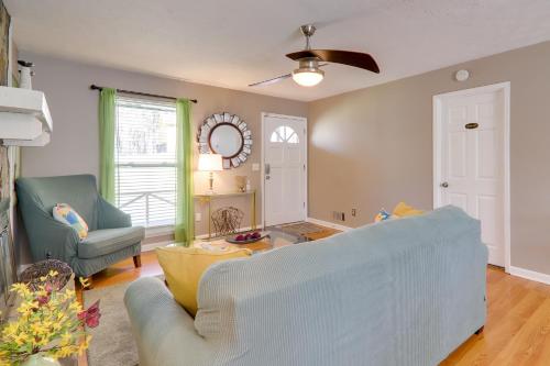 a living room with a couch and a chair at 6 Mi to Stone Mtn Park The Forrest Home with Deck in Snellville
