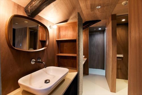 a bathroom with a sink and a mirror at kitan UOZU - Vacation STAY 18789 in Uozu