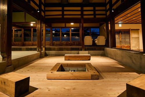a room with two benches and a pit in the middle at kitan UOZU - Vacation STAY 18789 in Uozu