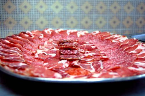 a pink pizza on a plate on a table at Hotel Villa San Donino in Città di Castello
