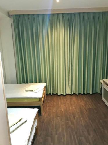 Кровать или кровати в номере Inn Požarevac
