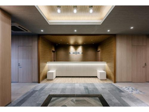 a large meeting room with a white table in the middle at Smile Hotel Okayama - Vacation STAY 60155v in Okayama