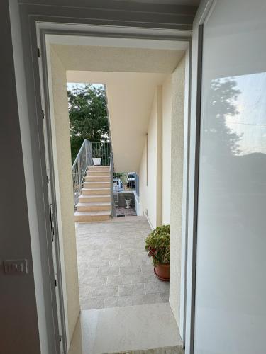 an open door of a house with a staircase at La casa di Nana' 1 in Casalbordino