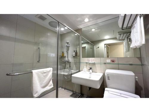 a bathroom with a toilet and a sink and a shower at Smile Hotel Sapporo Susukino Minami - Vacation STAY 60204v in Sapporo