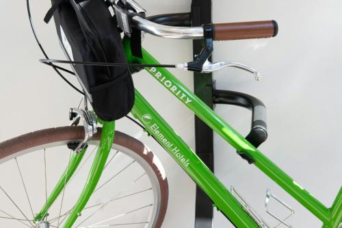 a green bike parked next to a wall at Element Opelika Auburn in Opelika