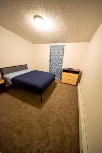 Una cama o camas en una habitación de Rewak Studios