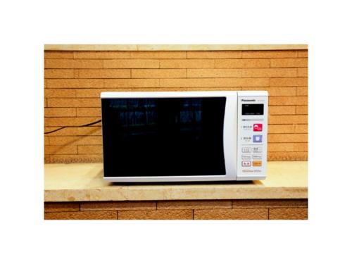 a microwave oven sitting on a wooden counter at Smile Hotel Yonago - Vacation STAY 61072v in Yonago