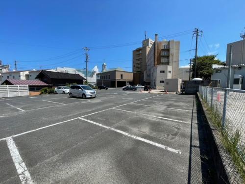 an empty parking lot with cars parked in it at Smile Hotel Yonago - Vacation STAY 61102v in Yonago