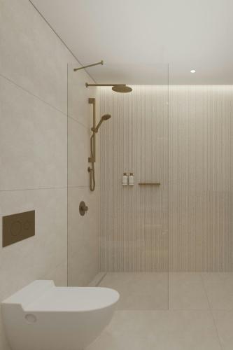 a bathroom with a shower with a toilet and a sink at The Landmark Nicosia, Autograph Collection in Nicosia