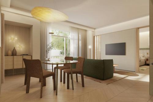 a living room with a dining room table and chairs at The Landmark Nicosia, Autograph Collection in Nicosia