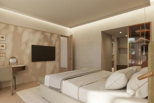 a bedroom with a large white bed and a television at The Landmark Nicosia, Autograph Collection in Nicosia