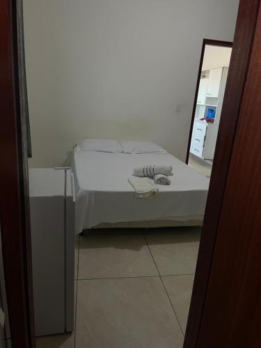 Ένα ή περισσότερα κρεβάτια σε δωμάτιο στο Loft Cantinho do Amor