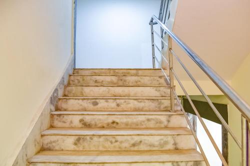 a set of stairs in a building at Hotel O S&h Residency Bahadalpur Railway Station in Khandagiri