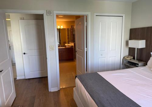 a hotel room with a bed and a bathroom at The Point Hotel Apartment 603 Near to Universal in Orlando