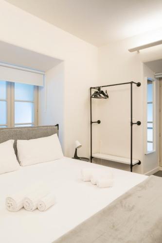 a bedroom with a white bed with towels on it at Turin Central Carlo Felice in Turin