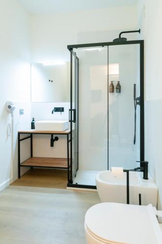 a bathroom with a shower and a toilet and a sink at Turin Central Carlo Felice in Turin