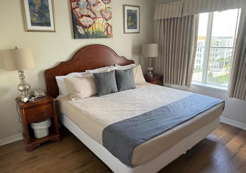 a bedroom with a large bed and a window at The Point Hotel & Suites - 705S Luxury - Pool view - Close to Universal in Orlando
