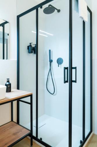 a shower with a glass door in a bathroom at Turin Central Carlo Felice in Turin