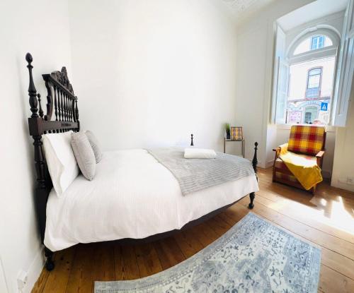 Ένα ή περισσότερα κρεβάτια σε δωμάτιο στο Luxury flat Sintra, next attractions
