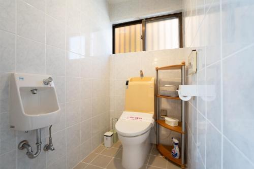 a bathroom with a toilet and a sink at -3F - Vacation STAY 19502 in Uruma
