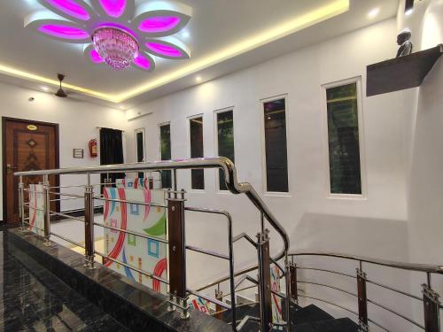 a staircase with a purple flower on the ceiling at THE VILLA Pondicherry in Puducherry