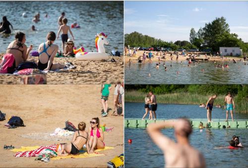a group of people on the beach at a lake at 1 House Between Two Lakes in Vilnius