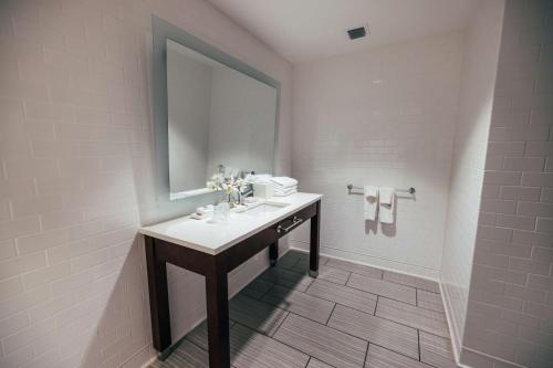 a bathroom with a sink and a mirror at Oceans Edge Key West in Key West