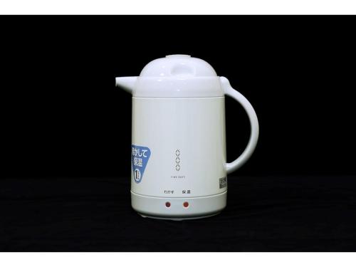a white coffee maker sitting on a table at Smile Hotel Kumagaya - Vacation STAY 64087v in Kumagaya