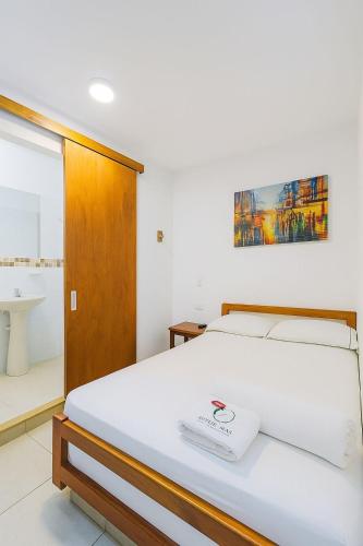 Кровать или кровати в номере Hotel Betania Plaza