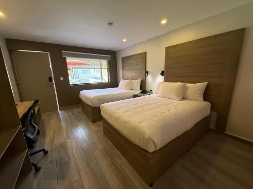 Cama o camas de una habitación en Comfort Inn Hermosillo Pitic