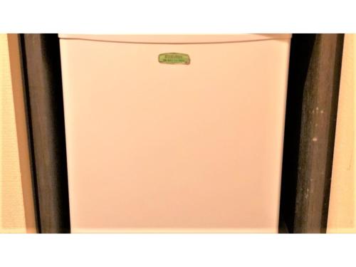 a white refrigerator in a kitchen with its door open at Smile Hotel Nagoya Sakae - Vacation STAY 66704v in Nagoya