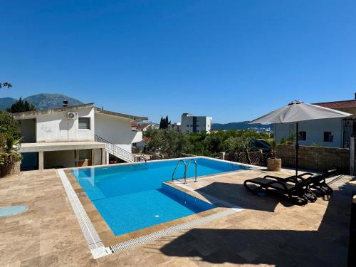 a swimming pool on the roof of a house at Sunny Nest Studio Bar in Bar