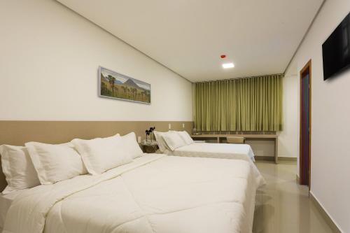 Säng eller sängar i ett rum på Liguori Hotel