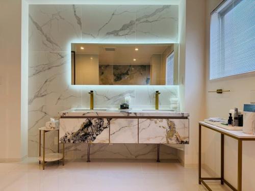 a bathroom with a sink and a mirror at Luxury Hills - Vacation STAY 19539 in Fukuoka