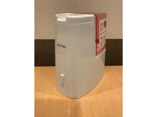 a white and red cooler sitting on a wooden floor at Smile Hotel Yonezawa - Vacation STAY 67030v in Yonezawa