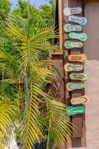 a group of signs on the side of a building at Casita Tres Trapi in Noord
