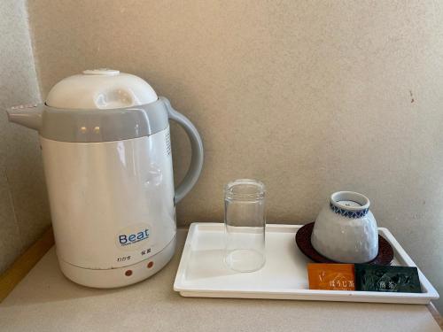 a blender sitting on a counter next to a container at Smile Hotel Tokyo Nishikasai - Vacation STAY 67970v in Tokyo