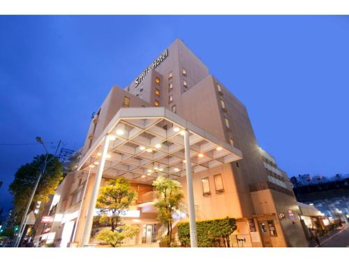 a building on a city street at night at Smile Hotel Tokyo Nishikasai - Vacation STAY 67970v in Tokyo