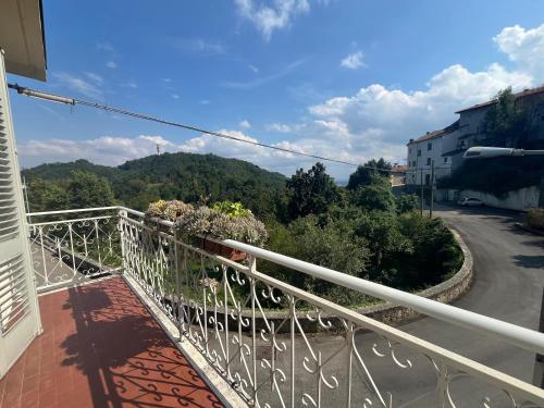 a balcony of a house with a view of a mountain at A Casa di Manu in Villadeati