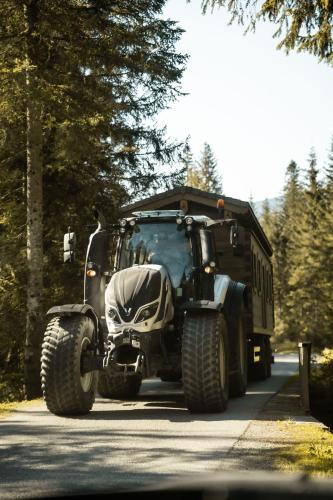 a large military truck driving down a road at Die Filzmooserin - Apartments in Filzmoos, Filzmoos Card inklusive in Filzmoos