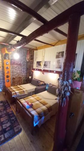 a large room with two beds and a couch at Vila do Covil in Tomar
