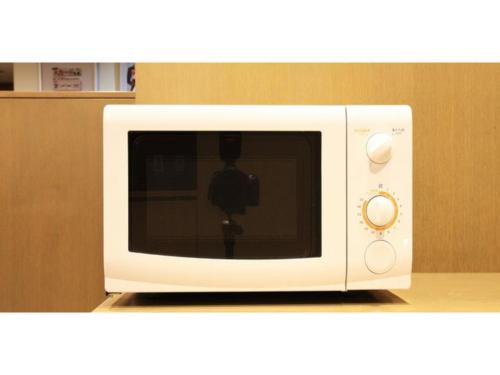 a white microwave on a counter in a kitchen at Smile Hotel Tomakomai - Vacation STAY 68902v in Tomakomai