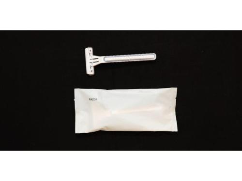 a white piece of paper and a tool on a table at Smile Hotel Tomakomai - Vacation STAY 68898v in Tomakomai