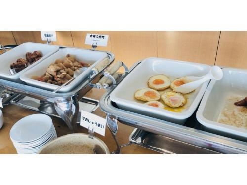 a buffet with eggs and other food in trays at Smile Hotel Tomakomai - Vacation STAY 68926v in Tomakomai