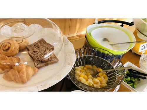 a plate of food with bread and vegetables on a counter at Smile Hotel Tomakomai - Vacation STAY 68926v in Tomakomai
