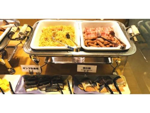 a buffet with different types of food in trays at Smile Hotel Tomakomai - Vacation STAY 68959v in Tomakomai