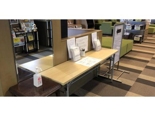 a counter in a store with a table in a room at Smile Hotel Tomakomai - Vacation STAY 68943v in Tomakomai
