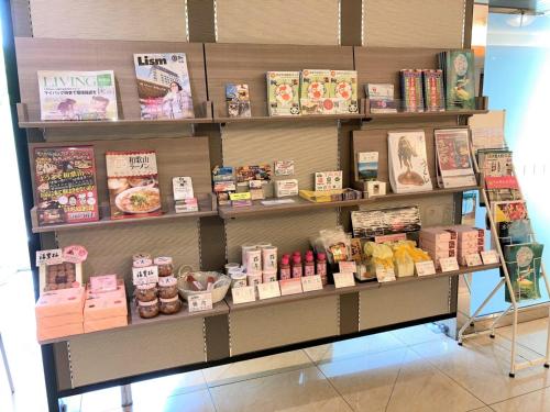 a store display of food and books on shelves at Smile Hotel Wakayama - Vacation STAY 69556v in Wakayama